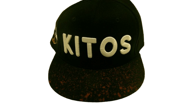 BLACK SPLASH SNAPBACK featuring a black kitos hat with a custom brim and gold accents.